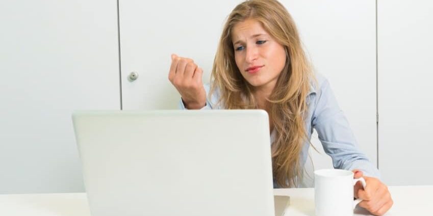 young woman with laptop and cup of tea think of anything else
